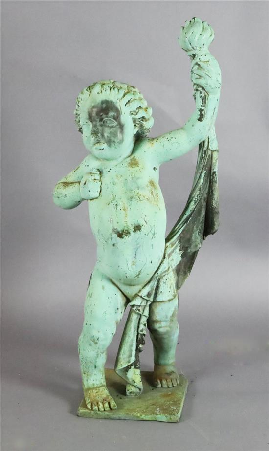 A bronzed lead garden statue of a putto holding aloft a torch, 39in.